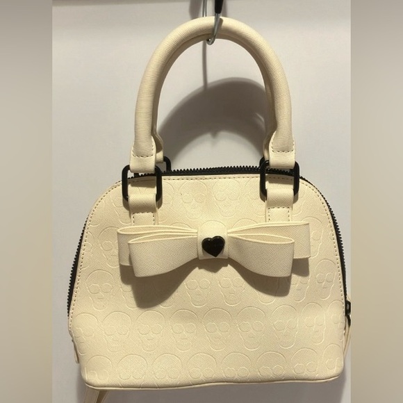 Betsey Johnson Handbags - 💙BETSEY JOHNSON MINI BAG CROSSBODY creme with skull embossed